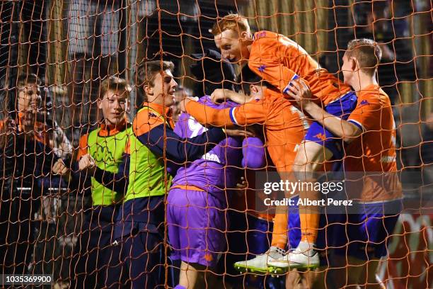 Lions FC players celebrate their victory after a penalty shoot-out during the NPL Semi Final match between Lions FC and Heidelberg United at Lions...