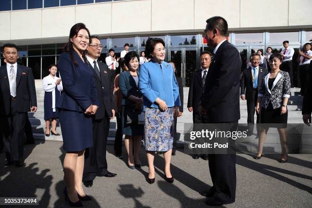 Kim Jung-sook , wife of South Korean President Moon Jae-in, talks with Ri Sol Ju , wife of North Korean leader Kim Jong Un, during a visit to the Kim...