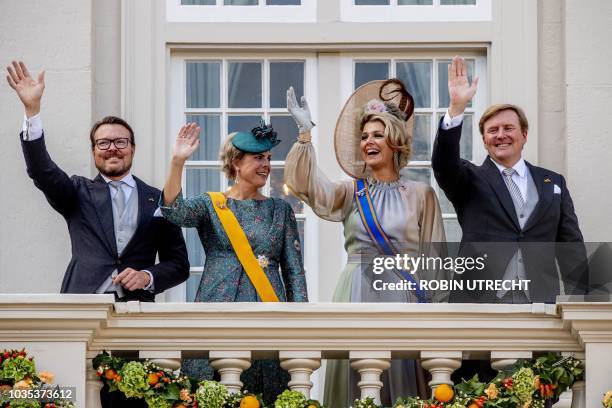Dutch Prince Constantijn, Princess Laurentien, Queen Maxima and King Willem-Alexander wave to the crowd from the balcony of the Palace Noordeinde in...