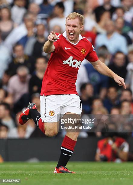 Paul Scholes of Manchester United celebrates as he scores their first goal during the Barclays Premier League match between Fulham and Manchester...
