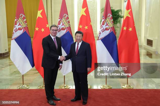 President of Serbian, Aleksandar Vucic shakes hands with Chinese President ,Xi Jinping at The Great Hall Of The People on September 18, 2018 in...