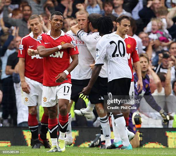 Luis Nani of Manchester United looks dejected as Brede Hangeland of Fulham scores their second goal during the Barclays Premier League match between...