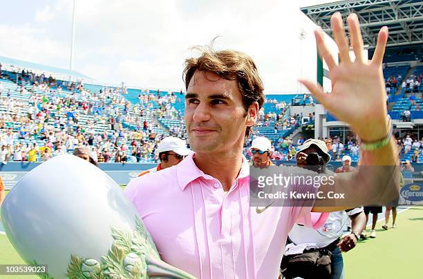 Roger Federer of Switzerland holds the trophy after defeating Mardy Fish during the finals on Day 7 of the Western & Southern Financial Group Masters...