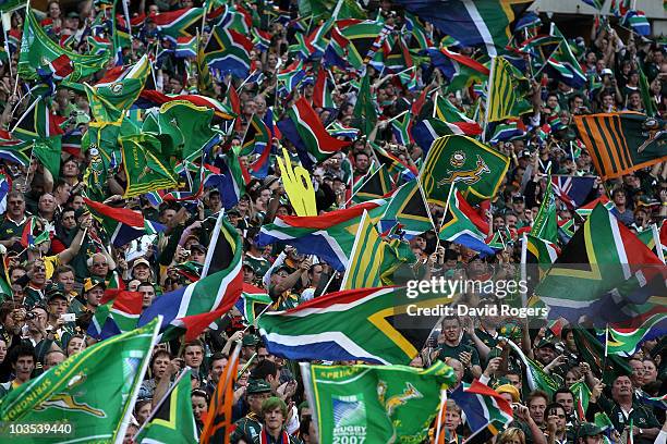 The South African supporters wave their flags during the 2010 Tri-Nations match between the South African Springboks and the New Zealand All Blacks...
