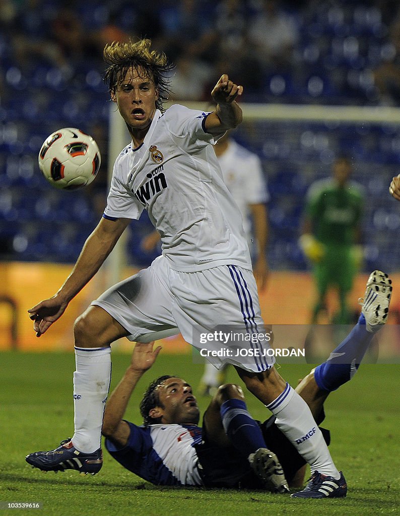 Hercules' Paco Pena (Bottom) vies for th