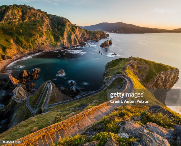 path to san juan de gaztelugatxe, basque country, spain - church sunset rural scene stock pictures, royalty-free photos & images