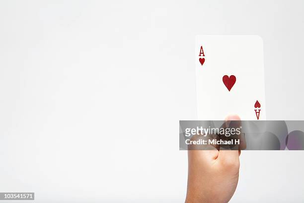 hand of child who has ace of heart - ace of hearts stock pictures, royalty-free photos & images