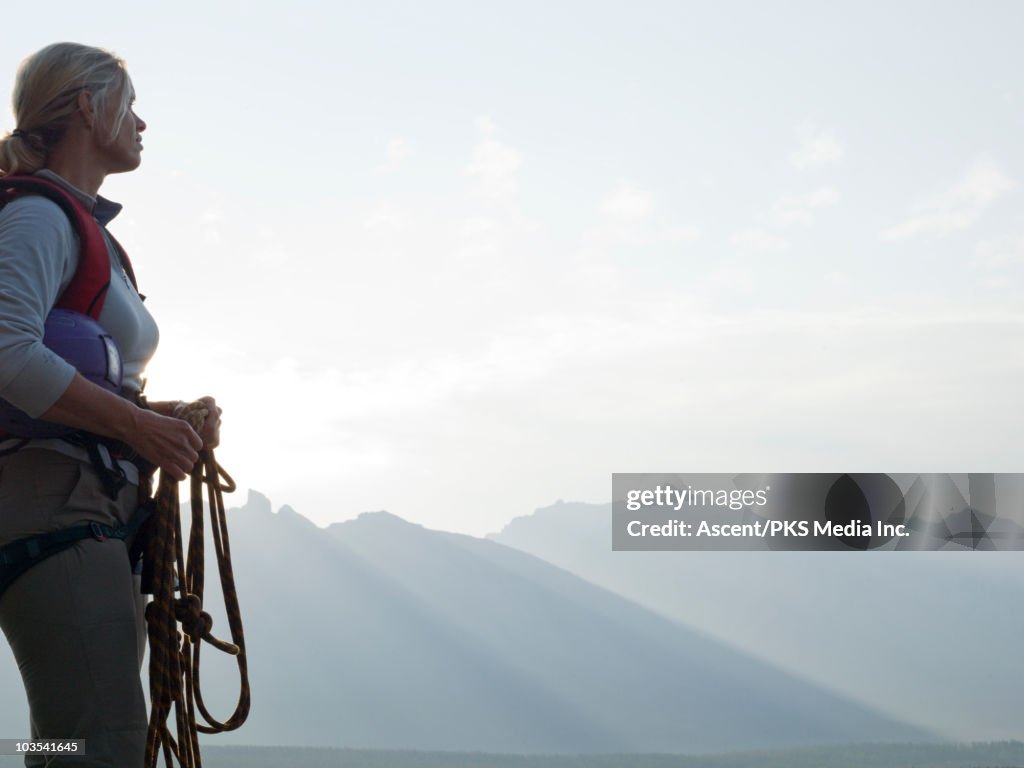 Portrait of female climber looking over mountains