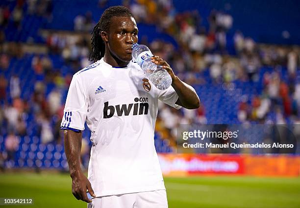 Royston Drenthe of Real Madrid drinks water after the pre-season friendly soccer match between Hercules and Real Madrid at Jose Rico Perez stadium on...