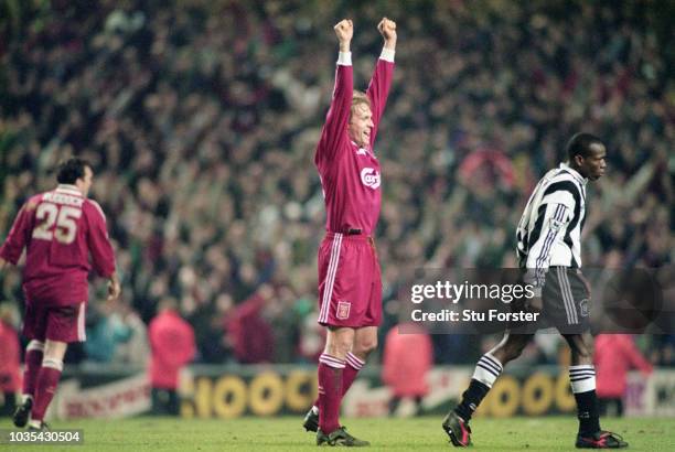 Liverpool defender John Scales celebrates on the final whistle as Faustino Asprilla looks on after the 4-3 Premier League match between Liverpool and...