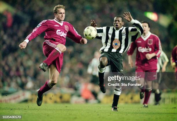 Liverpool defender John Scales challenges Newcastle forward Faustino Asprilla during the 4-3 Premier League match between Liverpool and Newcastle...