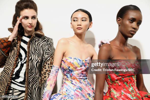 Models backstage ahead of the Richard Quinn show during London Fashion Week September 2018 on September 18, 2018 in London, England.