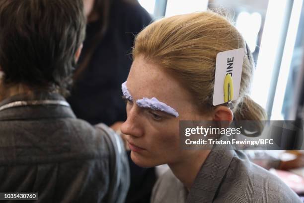 Model backstage ahead of the Richard Quinn show during London Fashion Week September 2018 on September 18, 2018 in London, England.