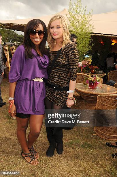 Alexandra Burke and guest pose for a photograph in the official VIP backstage area hosted by Mahiki during Day Two of V Festival 2010 on August 22,...