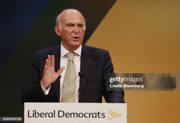 Vince Cable, leader of the U.K.'s Liberal Democrat Party, gestures as he delivers his keynote speech at the party's annual conference in Brighton,...