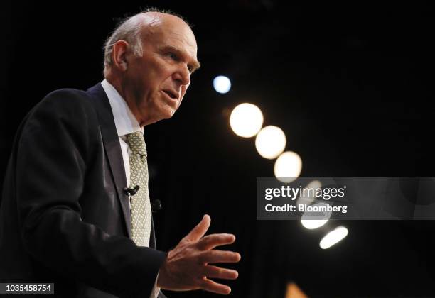 Vince Cable, leader of the U.K.'s Liberal Democrat Party, gestures as he delivers his keynote speech at the party's annual conference in Brighton,...