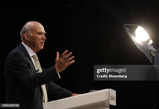 Vince Cable, leader of the U.K.'s Liberal Democrat Party, gestures as he delivers his keynote speech at the party's annual conference in Brighton,...