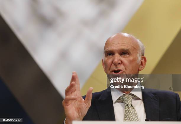 Vince Cable, leader of the U.K.'s Liberal Democrat Party, gestures as he delivers his keynote speech at the party's annual conference in Brighton,...