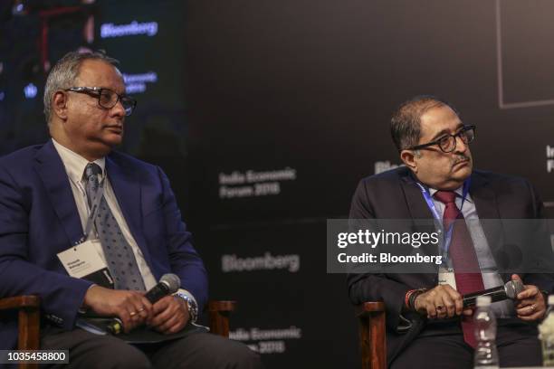 Vinayak Bahuguna, chief executive officer of Asset Reconstruction Co., left, sits beside Rahul Chawla, managing director of India at Deutsche Bank,...