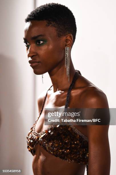 Model poses at the Mark Fast DiscoveryLAB during London Fashion Week September 2018 at the BFC Designer Showrooms on September 18, 2018 in London,...