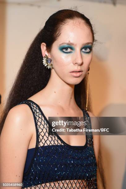 Model poses at the Mark Fast DiscoveryLAB during London Fashion Week September 2018 at the BFC Designer Showrooms on September 18, 2018 in London,...