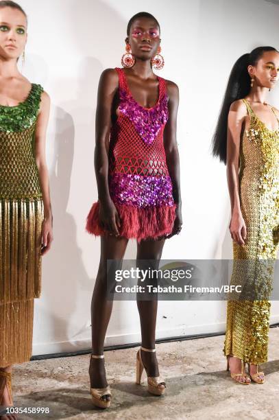 Models pose at the Mark Fast DiscoveryLAB during London Fashion Week September 2018 at the BFC Designer Showrooms on September 18, 2018 in London,...