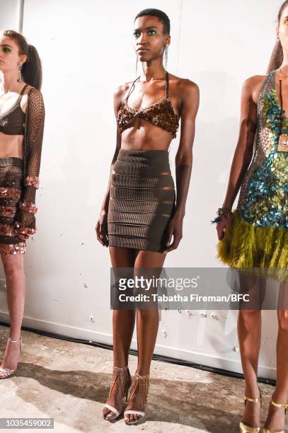 Models pose at the Mark Fast DiscoveryLAB during London Fashion Week September 2018 at the BFC Designer Showrooms on September 18, 2018 in London,...