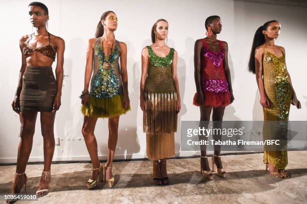 Models pose at the Mark Fast DiscoveryLAB during London Fashion Week September 2018 at the BFC Designer Showrooms on September 18, 2018 in London,...