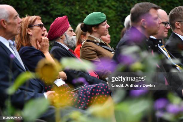 Guests look-on as Prince William, Duke of Cambridge unveils a new sculpture of Major Frank Foley by artist Andy de Comyn on September 18, 2018 in...
