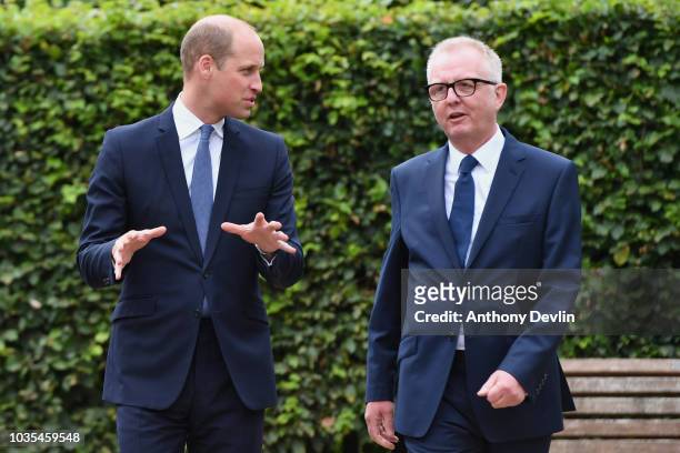 Prince William, Duke of Cambridge speaks with Ian Austin MP before unveiling a new sculpture of Major Frank Foley by artist Andy de Comyn on...
