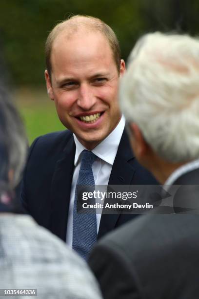 Prince William, Duke of Cambridge speaks with families of those helped by Major Frank Foley before unveiling a new sculpture of Major Foley by artist...