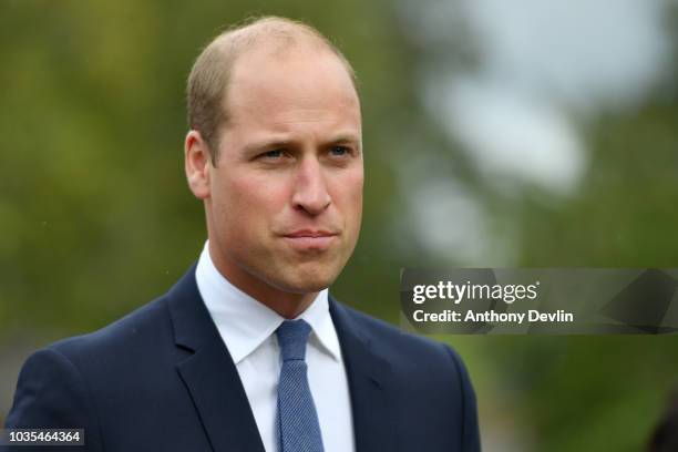 Prince William, Duke of Cambridge speaks with families of those helped by Major Frank Foley before unveiling a new sculpture of Major Foley by artist...