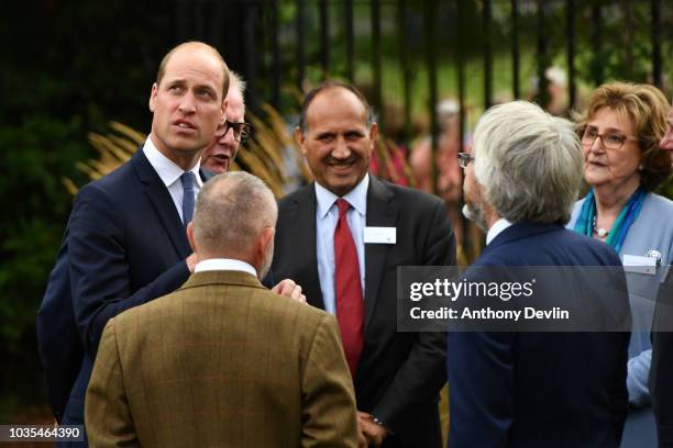 Prince William, Duke of Cambridge speaks with families of those helped by Major Frank Foley before unveiling a new sculpture of Major Foley by artist...