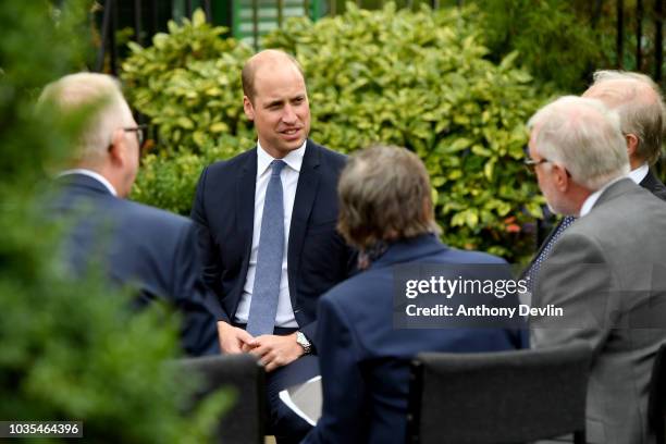 Prince William, Duke of Cambridge speaks with families of those helped by Major Frank Foley before unveiling a new sculpture of Major Foley by artist...