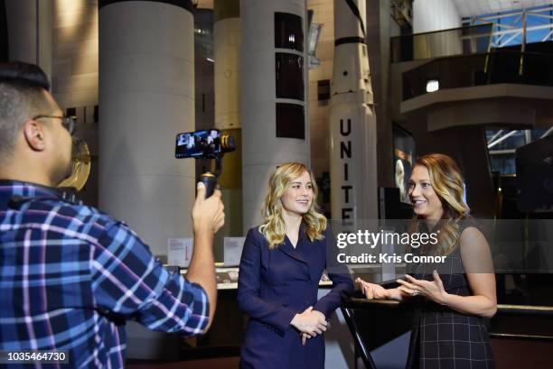 Brie Larson and GMA host Ginger Zee attend Marvel Studios' "CAPTAIN MARVEL" Teaser Trailer Launch at National Air & Space Museum on September 18,...