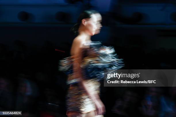 Model walks the runway at the Richard Quinn show during London Fashion Week September 2018 on September 18, 2018 in London, England.