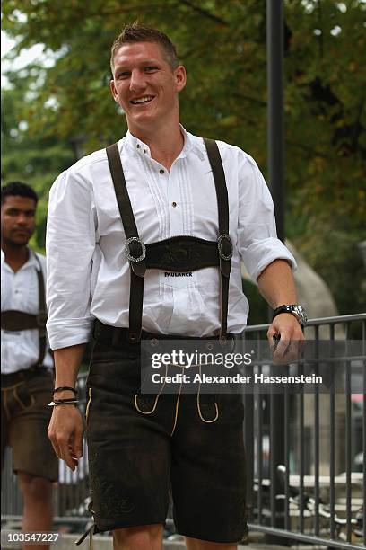 Bastian Schweinsteiger of Bayern Muenchen arrives for the Paulaner photocall at the Nockerberg Biergarden on August 23, 2010 in Munich, Germany.