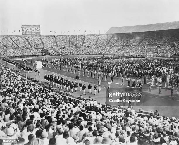 The South African team marches past during the opening ceremony of the 1948 Olympic Games, Wembley Stadium, London, 29th July 1948.