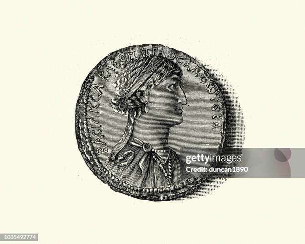 ancient coin showing a portrait of cleopatra - cleopatra stock illustrations