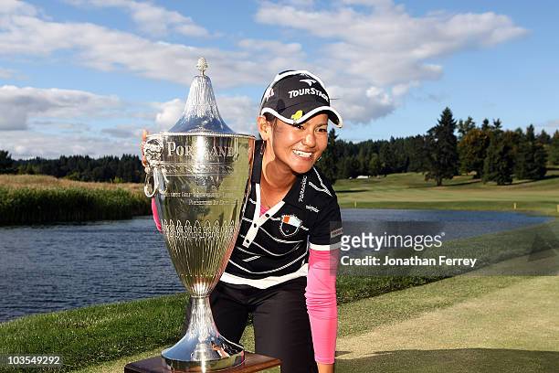 Ai Miyazato poses with the trophy after winning the Safeway Classic at Pumpkin Ridge Golf Club on August 22, 2010 in North Plains, Oregon. Miyazato...