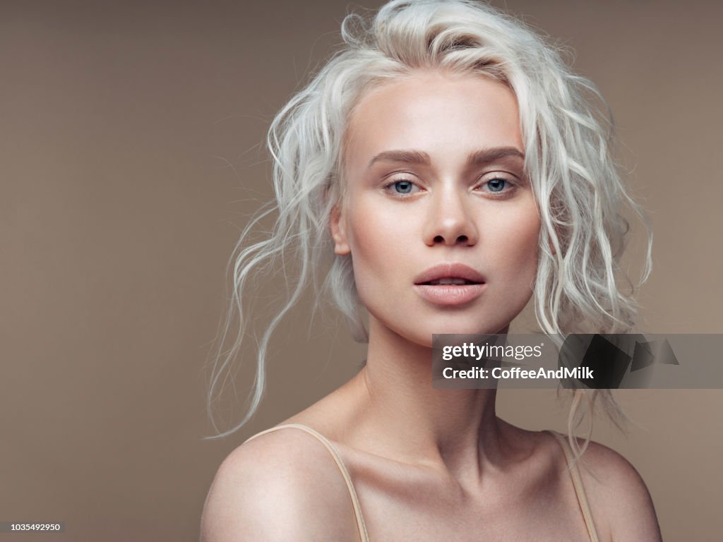 Beautiful woman with make-up and stylish hairstyle