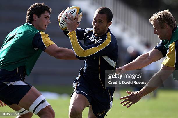 Quade Cooper runs with the ball during an Australian Wallabies training session Bishops High School on August 23, 2010 in Cape Town, South Africa.