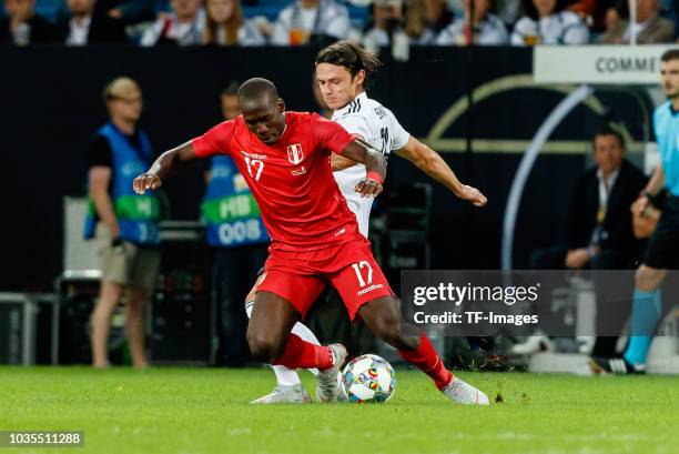 Anderson Advincula of Peru and Nico Schulz of Germany battle for the ball during the International Friendly match between Germany and Peru on...