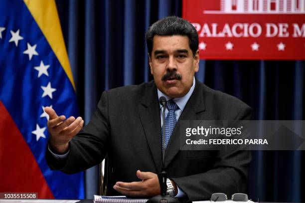 Venezuelan President Nicolas Maduro speaks during a press conference with international media correspondents following his recent trip to China, at...
