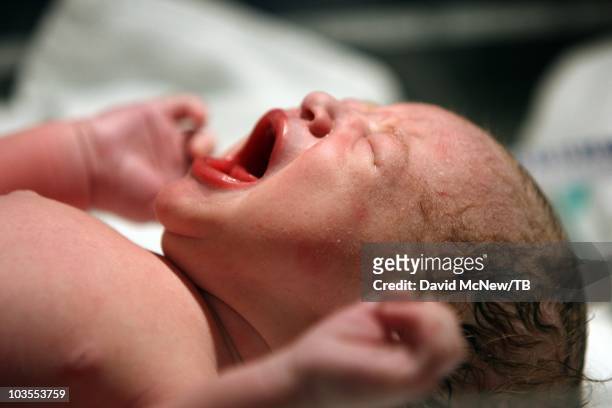 Thomas Beatie, a transgender male, gives birth to son Jensen James Beatie with his wife Nancy by his side at Saint Charles Medical Center on July 25,...