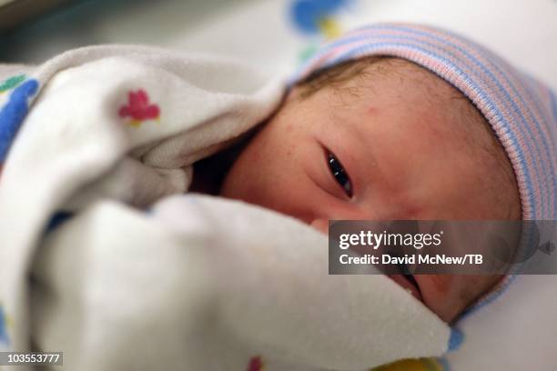 Thomas Beatie, a transgender male, gives birth to son Jensen James Beatie with his wife Nancy by his side at Saint Charles Medical Center on July 25,...