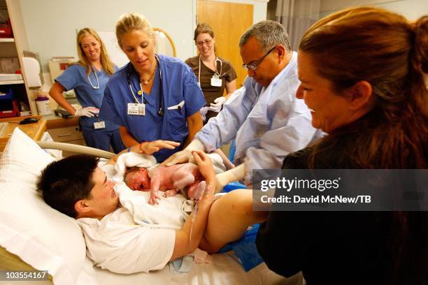 Thomas Beatie, a transgender male, gives birth to son Jensen James Beatie with his wife Nancy by his side at Saint Charles Medical Center on July 25,...