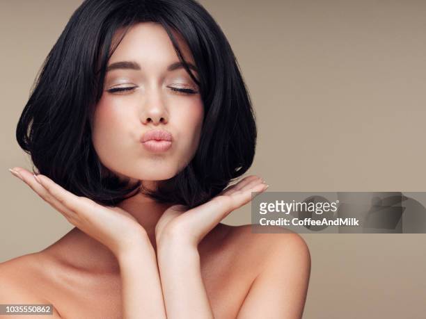 beautiful woman - studio kiss stock pictures, royalty-free photos & images