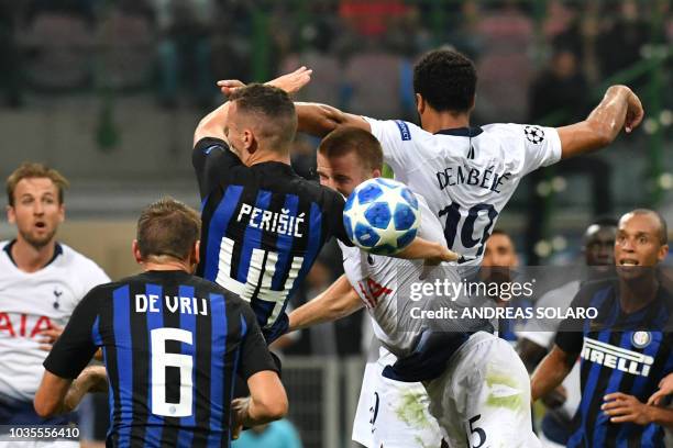 Inter Milan's Croatian midfielder Ivan Perisic, Tottenham's English midfielder Eric Dier and Tottenham's Belgian midfielder Moussa Dembele go for a...