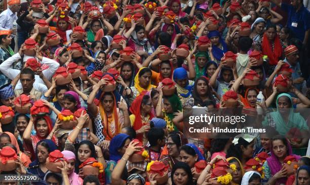 Women of Sindhi Community carry pots filled with worshipped food items on their head and immersed it in a lake located nearby the Chaliha Sahib...